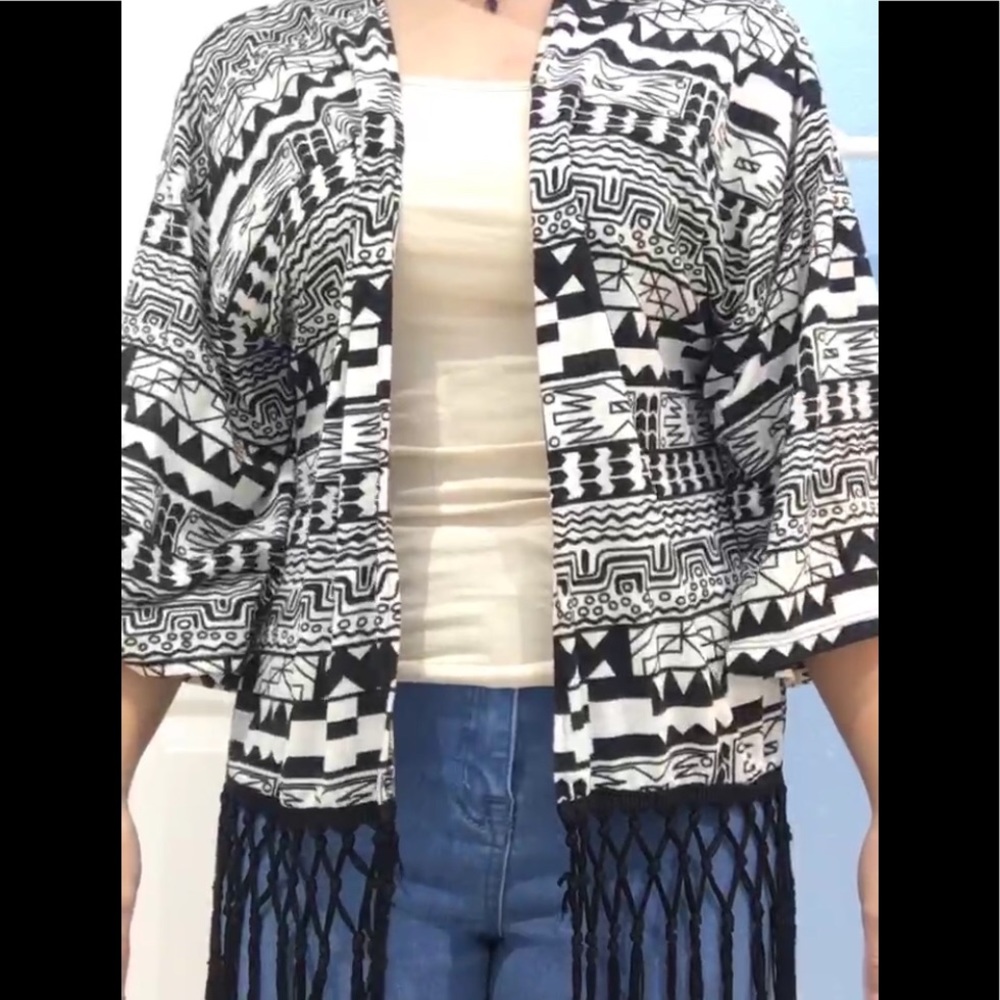 a black and white patterned cardigan